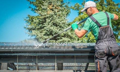 AdobeStock_215815730-cleaning-roof-gutter.jpeg